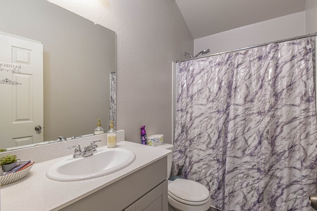 full bathroom with vanity, vaulted ceiling, shower / tub combo with curtain, and toilet