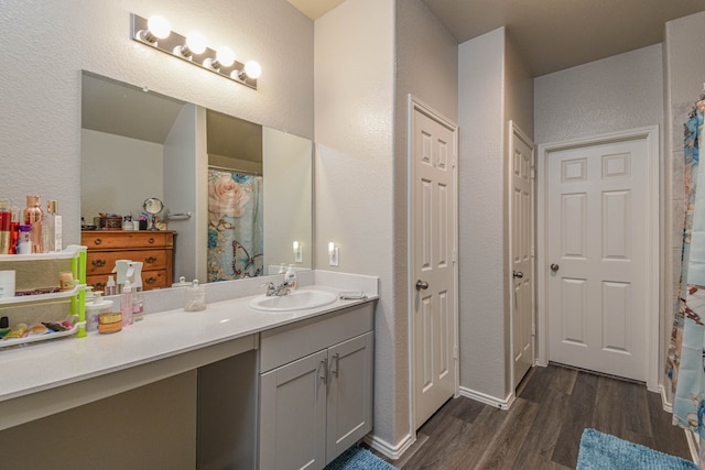 bathroom featuring wood-type flooring and vanity