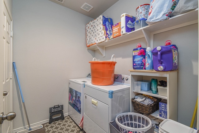 laundry area with washing machine and clothes dryer