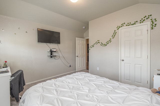 carpeted bedroom featuring vaulted ceiling