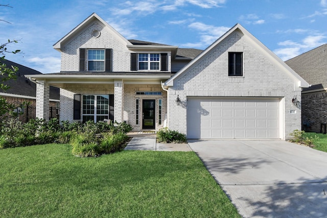 view of front of house featuring a garage, a front yard, and covered porch