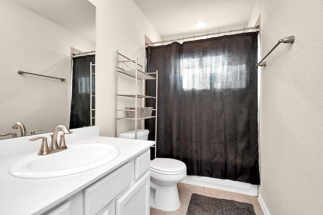 full bathroom featuring shower / tub combo with curtain, vanity, toilet, and tile patterned floors