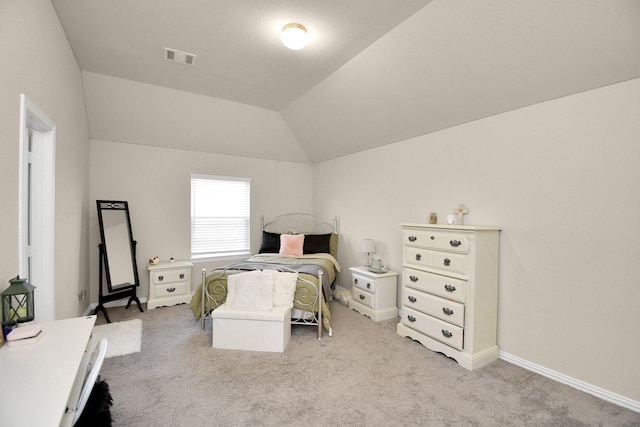 carpeted bedroom featuring lofted ceiling