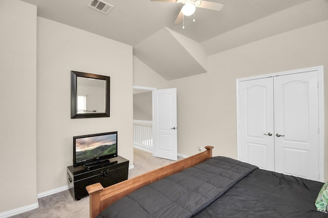 bedroom featuring lofted ceiling, carpet flooring, ceiling fan, and a closet