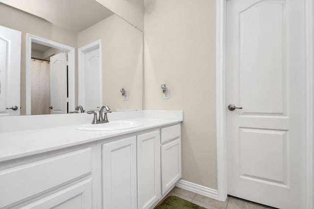 bathroom with tile patterned floors and vanity