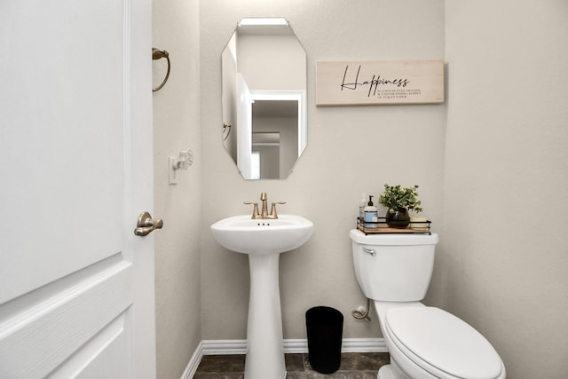 bathroom featuring sink and toilet