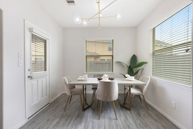 dining area featuring hardwood / wood-style floors