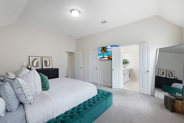 carpeted bedroom featuring vaulted ceiling