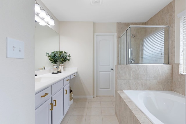 bathroom featuring tile patterned floors, vanity, and independent shower and bath