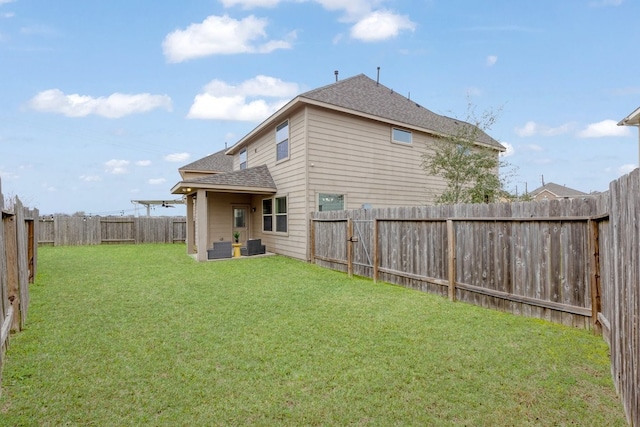 back of property featuring a lawn