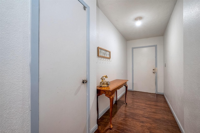 doorway with dark wood-type flooring