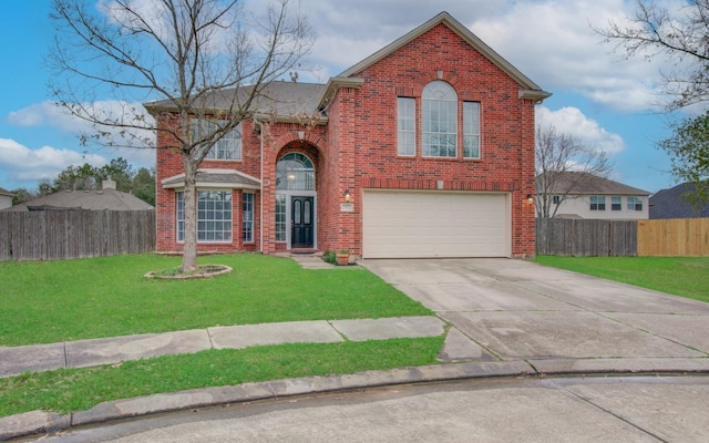 view of property with a garage and a front yard