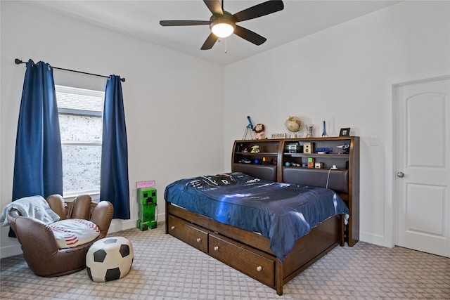 carpeted bedroom with baseboards and ceiling fan