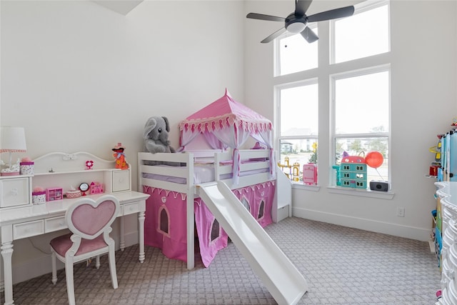 bedroom with carpet floors and baseboards