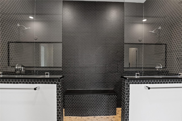 interior space featuring walk in shower and a sink