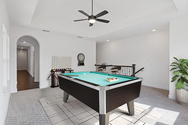 game room with light carpet, billiards, and a raised ceiling