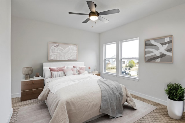 bedroom with light colored carpet and ceiling fan