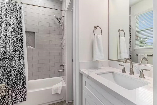 bathroom featuring shower / tub combo with curtain and vanity