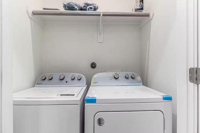 laundry room with independent washer and dryer