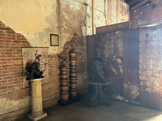 215 E Main St, Eagle Lake, TX 77434 - wine area with concrete floors and brick wall