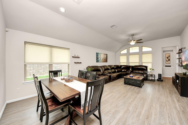 dining area featuring lofted ceiling, ceiling fan, and light hardwood / wood-style flooring