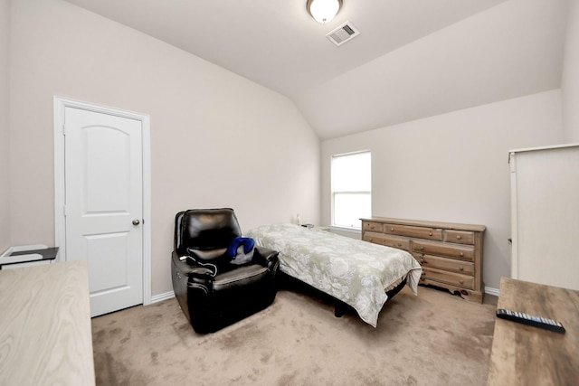 bedroom with carpet and lofted ceiling