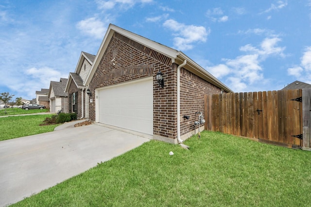 view of side of home with a garage and a yard