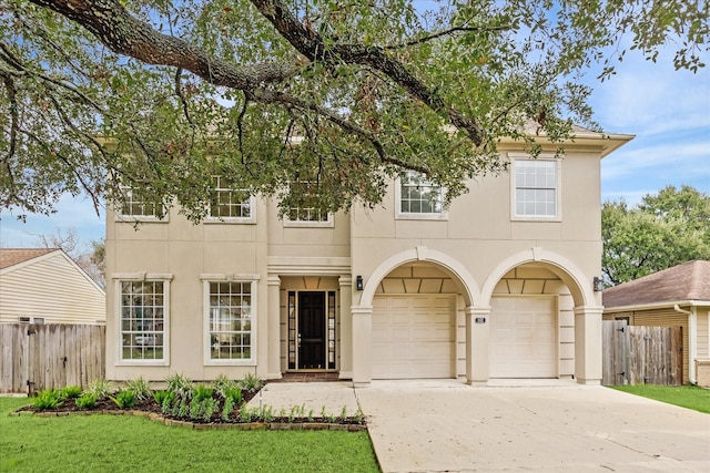 view of front of home with a garage and a front lawn