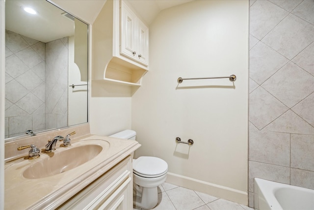 bathroom with tile patterned flooring, vanity, a washtub, and toilet