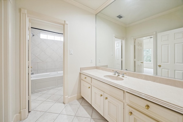 bathroom with crown molding, tiled shower / bath, tile patterned floors, and plenty of natural light