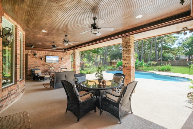 view of patio with a fenced in pool, a fenced backyard, and a ceiling fan