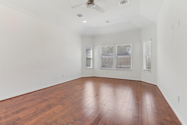 spare room featuring ceiling fan, ornamental molding, and dark hardwood / wood-style flooring