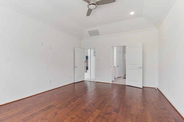 unfurnished room with ornamental molding, dark wood-type flooring, vaulted ceiling, and ceiling fan