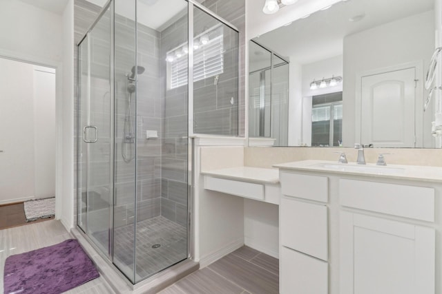 bathroom featuring vanity and walk in shower