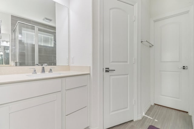 bathroom featuring vanity and walk in shower