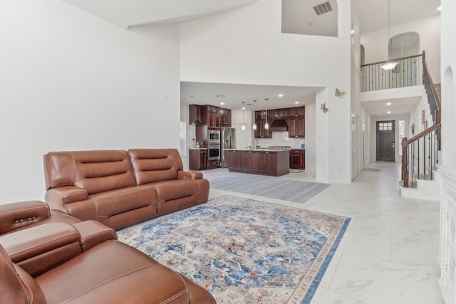 living room with a high ceiling