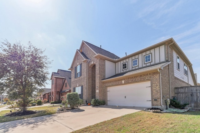 view of front of house featuring a front yard and a garage