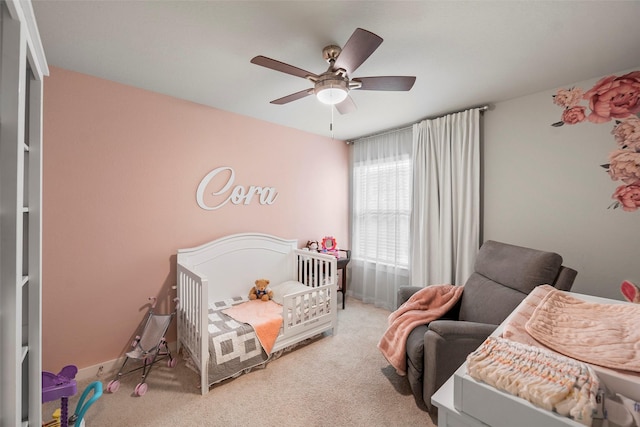 carpeted bedroom with ceiling fan