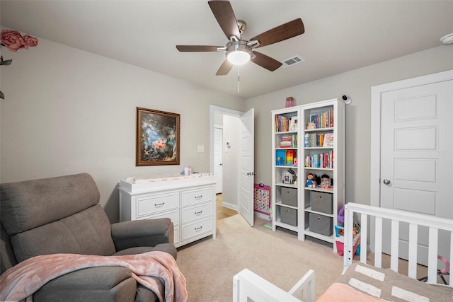 carpeted bedroom with ceiling fan