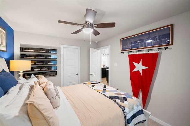 carpeted bedroom with ceiling fan