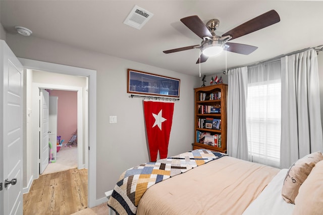 bedroom featuring ceiling fan and light hardwood / wood-style floors