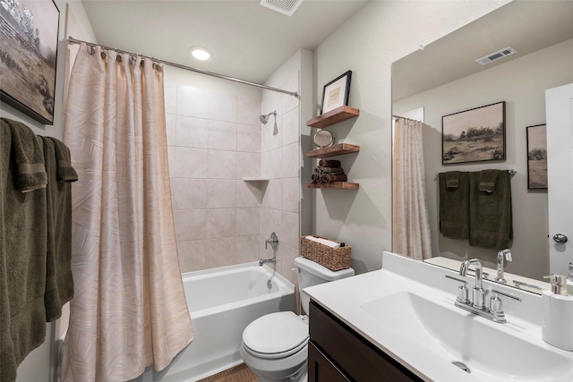 full bathroom with vanity, toilet, and shower / tub combo