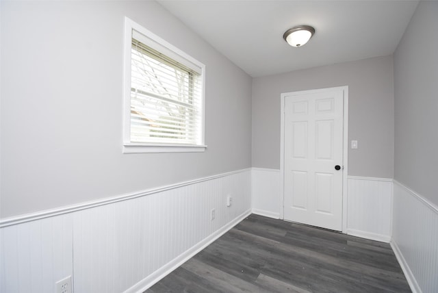 empty room with dark wood-type flooring