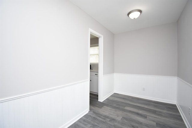 empty room featuring dark wood-type flooring