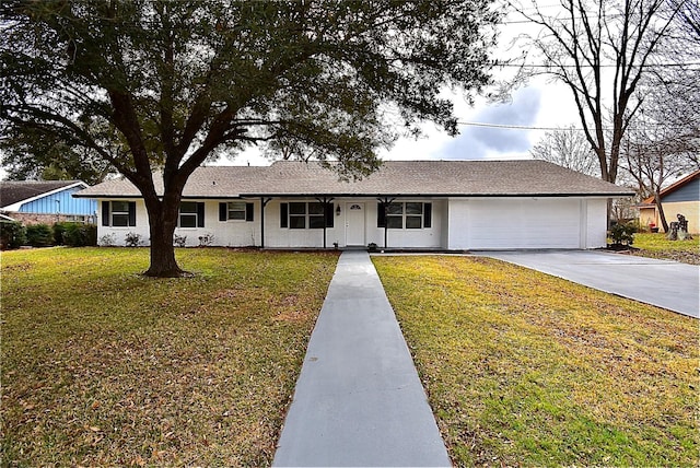 single story home featuring concrete driveway, an attached garage, and a front lawn