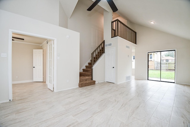 unfurnished living room with high vaulted ceiling and ceiling fan