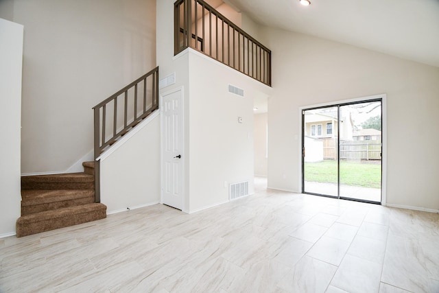 interior space featuring high vaulted ceiling