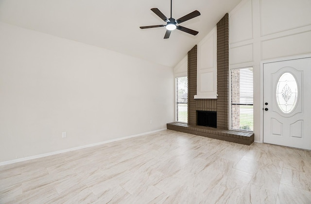 unfurnished living room featuring ceiling fan, a fireplace, and high vaulted ceiling