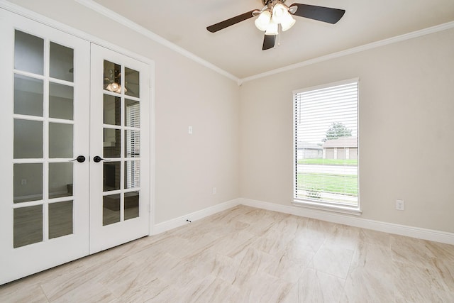 spare room with ornamental molding, french doors, and ceiling fan