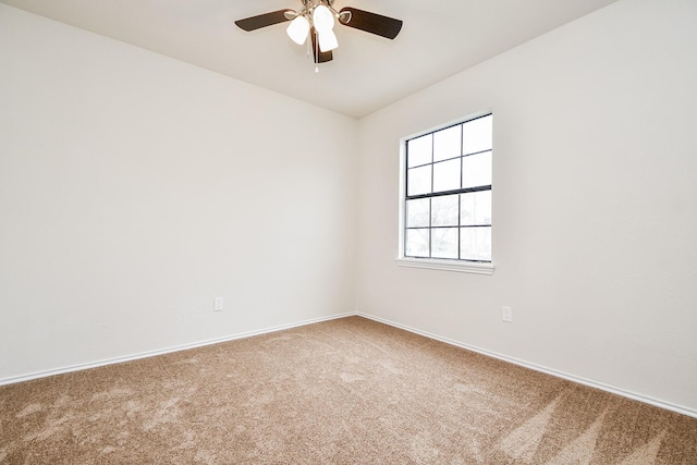 empty room with ceiling fan and carpet flooring